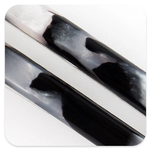 Macro detail of French vintage acetate hair claw showing marble fluid texture effects