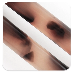 Macro shot of French vintage acetate hair claw showing translucent gradient texture