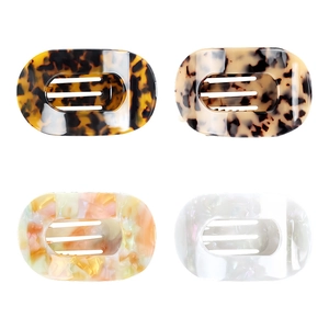 Set of four tortoiseshell and pearlescent acetate claw clips in oval hollowed design