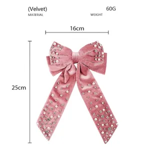 Pink velvet bow hair clip with white pearls and rhinestones measuring 16cm by 25cm