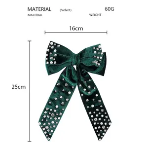 Detail showing deep green velvet bow hair clip with pearls and size 16cm x 25cm
