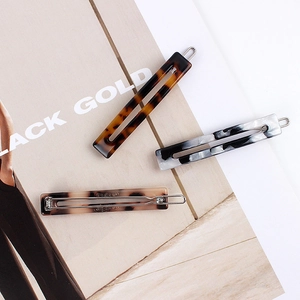 Classic acetate hollow rectangular hair clips set in tortoise shell and marble patterns