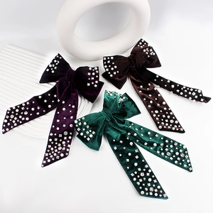 Velvet bow hair clips with pearls and rhinestones in purple, green, and brown colors