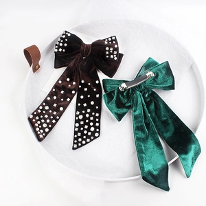 Elegant velvet bow hair clips with pearls and crystals in emerald and brown colors