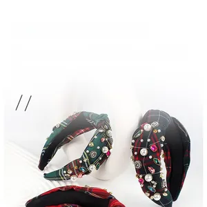 Close-up of vintage plaid headband with inlaid pearls and colorful crystal rhinestones