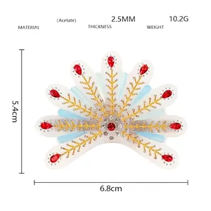 Détails techniques du clip à cheveux en acétate avec gemmes rouges et paillettes d'or