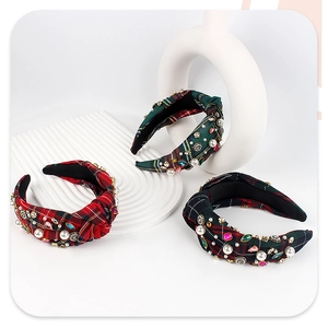 Detail of plaid headbands with pearls, rhinestones, and bee charms for Christmas