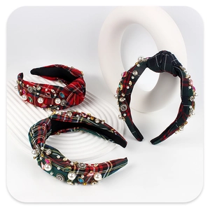Close-up of three luxury plaid headbands featuring hand-set pearls and colorful rhinestones