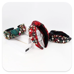 Detail of plaid headbands with pearls and colorful rhinestones for Christmas style