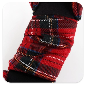 Detailed macro view showing the soft texture of red and black tartan fabric with diamond studs
