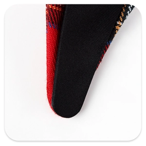 Detailed close-up of plaid fabric headband showing stitching and textile texture