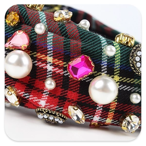 Detail of plaid headband with hand-stitched faux pearls and colorful rhinestones