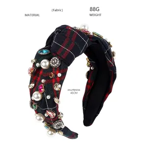 Detail view of plaid fabric headband with colorful rhinestones and pearls