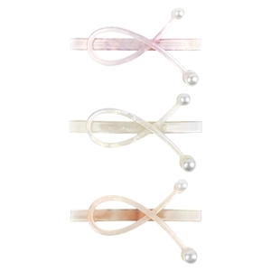 Three-piece set of acetate hair clips with pearl accents in marble texture finish