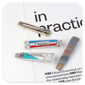 Creative toothpaste tube hair clips made of high-quality acetate resin on magazine