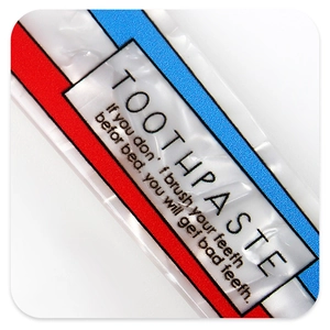 Detailed macro view of acetate toothpaste-shaped hair clip with vibrant color blocking