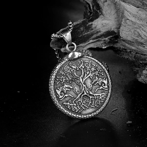Detailed engraving of Viking Tree of Life with wolves on stainless steel pendant