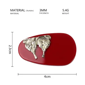 Detailed specs of red acetate hair clip with golden butterfly 4cm x 2.3cm size