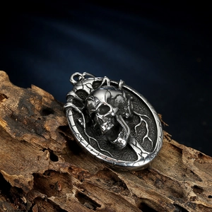 Macro shot of skull pendant with vine texture on weathered wood background