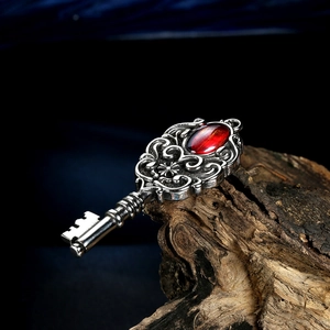 Vintage punk style stainless steel key pendant necklace with a red oval gemstone
