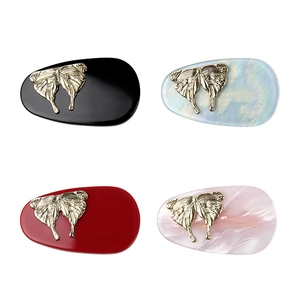 Set of four acetic acid butterfly hair clips in black, white, red, and marble pink colors