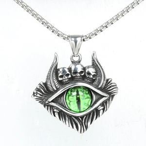 Vintage gothic evil eye necklace with green eye stone and three silver skulls