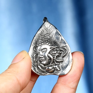 Retro titanium steel zodiac Buddha pendant with intricate leaf-shaped embossed detail
