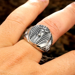 Macro shot of retro stainless steel ring with ancient Egyptian Pharaoh design