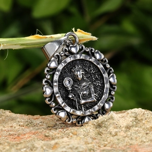 Vintage stainless steel skull necklace with detailed relief carving and zircon stone