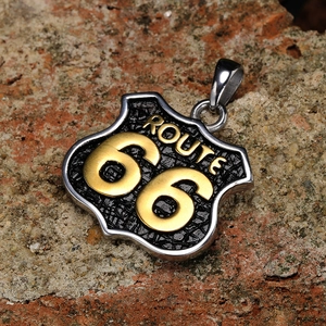 Retro punk style Route 66 shield pendant in stainless steel for men on a stone background