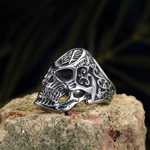 Macro view of a Masonic skull ring in vintage stainless steel with intricate carvings