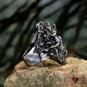 Macro side view of gothic skull ring showing dark antique silver finish and lava texture