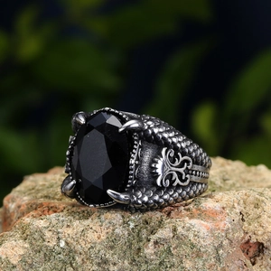 Vintage dragon claw ring for men featuring a large oval black gemstone and scale texture