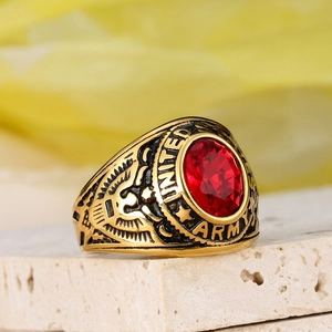 Golden United States Army signet ring with oval red gemstone and eagle engraving
