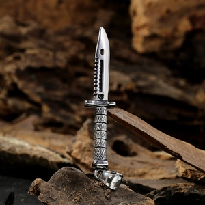 Men's stainless steel long tactical dagger pendant necklace on dark wooden background