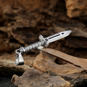 Men's stainless steel necklace with vintage silver dagger pendant on rustic bark backdrop