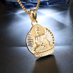 Macro shot of hip hop Buddha pendant in gold finish with radial hollow design