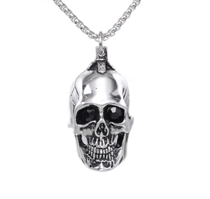 Punk style silver skull pendant necklace with black gemstone eyes and metal chain