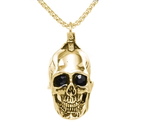 Punk style gold skull pendant necklace with black zircon eyes on white background