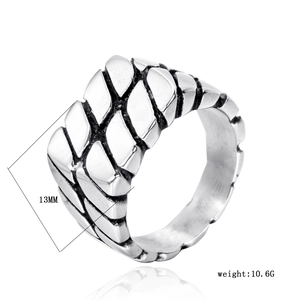 Detail of 13mm wide stainless steel ring with industrial chain pattern and brushed finish