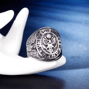 Macro shot of the United States Army eagle emblem on a vintage steel ring