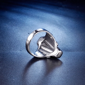 Macro view of silver gothic stainless steel ring with 3D embossed relief patterns