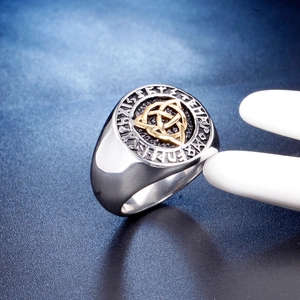 Vintage steel signet ring for men with golden Celtic knot and engraved runes