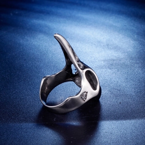 Macro shot of silver viking raven skull steel ring with engraved geometric symbols