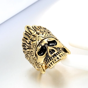 Macro shot of gold-plated titanium steel ring with Indian chief skull design
