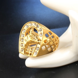 Detail of gold horse shoe ring for men featuring micro-pave stones and hollow band