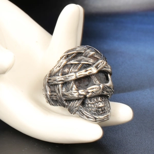 Gothic skull ring made of vintage stainless steel with textured wrap design
