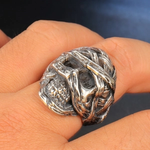 Close-up of a vintage skull ring for men with intricate mummy textures and oxidized finish