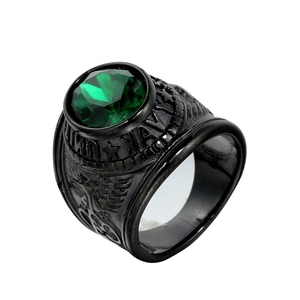 Detailed view of men's military signet ring with green gemstone and Navy eagle engraving