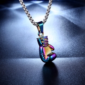 Macro detail of rainbow plated boxing glove pendant with silver box chain necklace